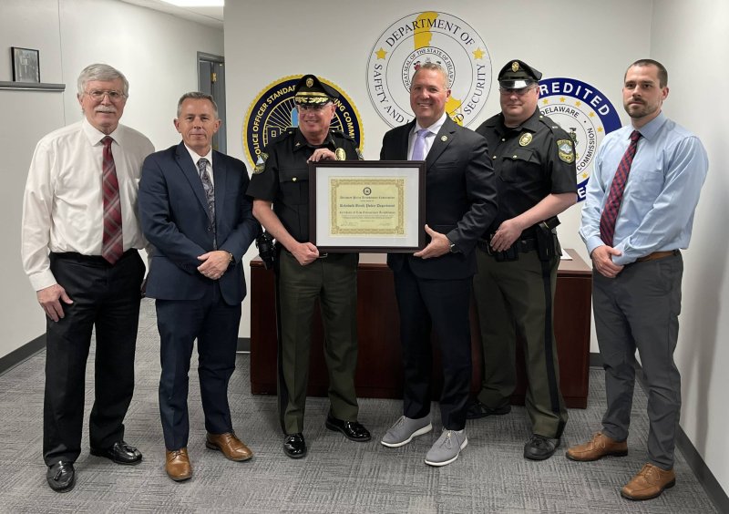 Gathered to mark the Rehoboth Beach Police Department accreditation are (l-r) Rehoboth Beach Mayor Stan Mills, POST Executive Director Sean E. Moriarty, Rehoboth Beach Police Chief Keith Banks, DSHS Secretary Joshua Bushweller, RBPD Lt. Mark Sweet and Assistant City Manager Evan Miller.
